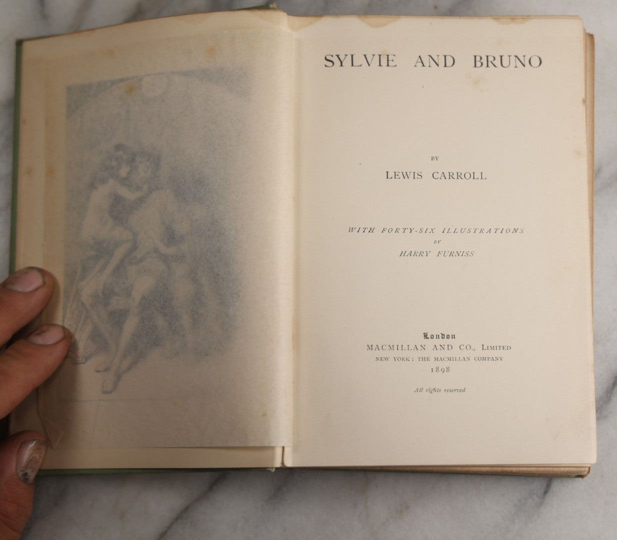 Lot 188 - Pair Of Antique Books, "Sylvie And Bruno" And "Sylvie And Bruno Concluded" By Lewis Carroll, Matching Illustrated Green Cloth Covers With Red And Black Designs, Macmillan And Co., Limited, Publisher, London, 1898