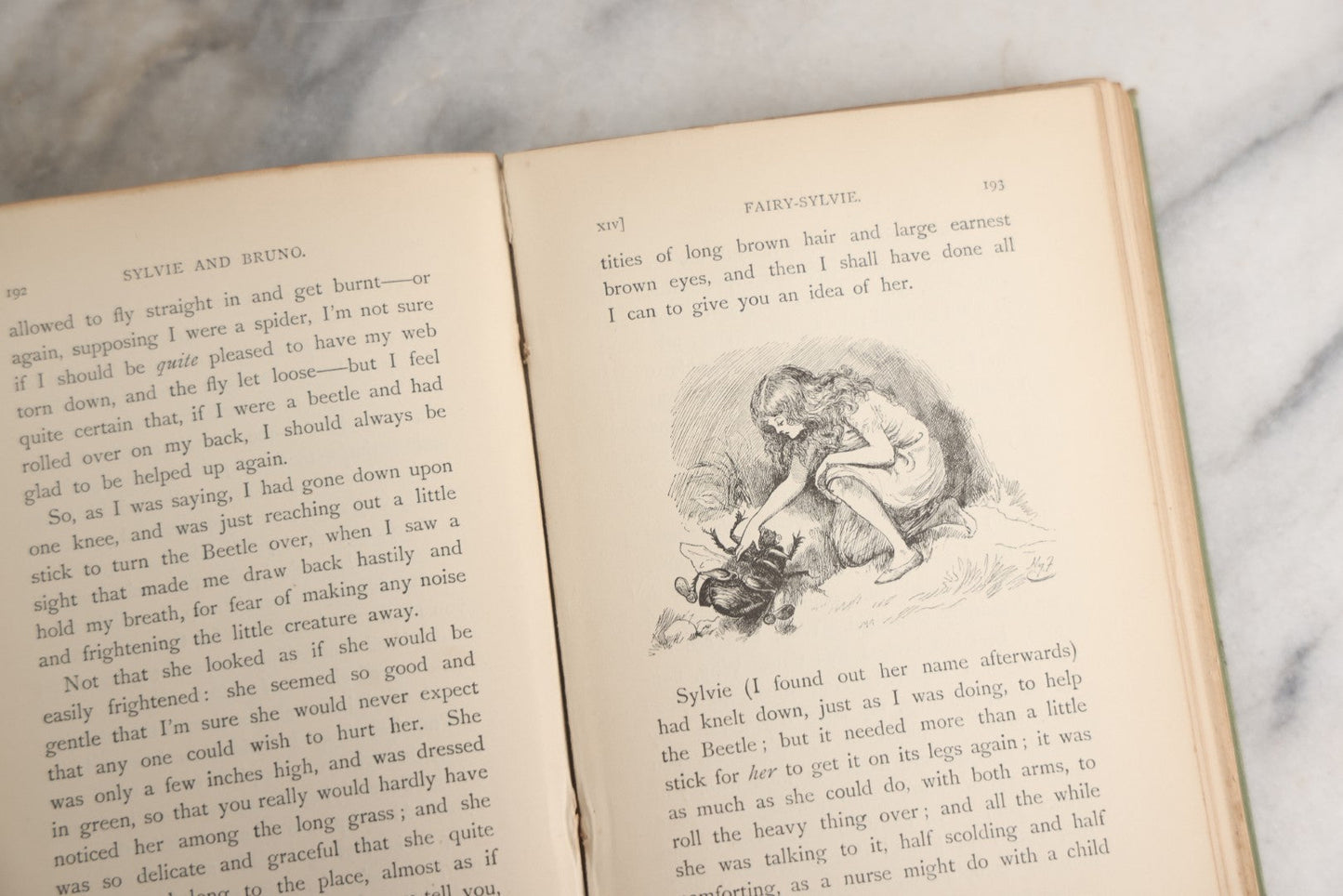 Lot 188 - Pair Of Antique Books, "Sylvie And Bruno" And "Sylvie And Bruno Concluded" By Lewis Carroll, Matching Illustrated Green Cloth Covers With Red And Black Designs, Macmillan And Co., Limited, Publisher, London, 1898