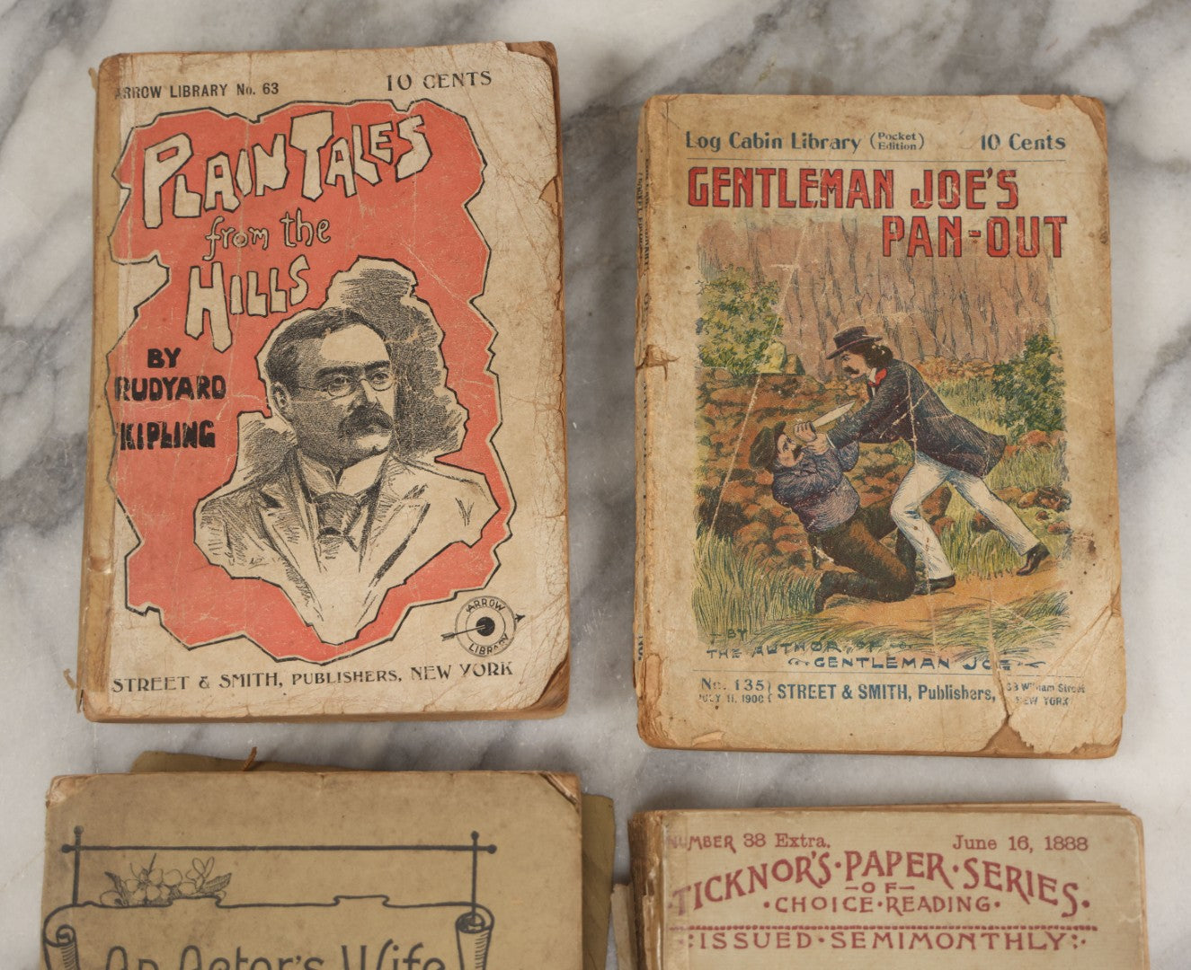 Lot 267 - Lot Of Antique Paperback Novels, "Plain Tales From The Hills" By Rudyard Kipling, "Gentleman Joe's Pan-Out" Log Cabin Library Edition, "An Actor's Wife" By George Moore, And "Looking Backward" By Edward Bellamy