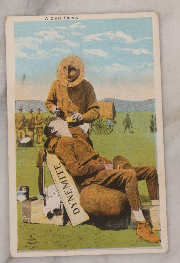 Lot 082 - Grouping Of Five Antique World War One Era Postcards Documenting The War Including Comic Illustration, Uncle Sam Placing Kaiser In Garbage, Soldier Shaving, Tank In Action, Motorcycle Ambulance, And Rifle Practice