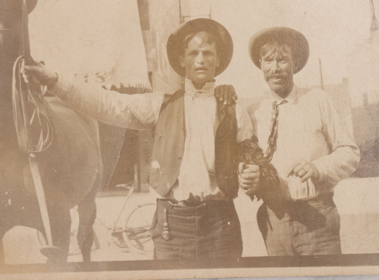 Lot 097 - Grouping Of Three Antique Unmounted Paper Photographs Of Men Posing In And Around Albany County, New York, Including With Horses, In Front Of Confectionary Shop, And Holding Paper With Headline "Choicelest Lands, Albany County"