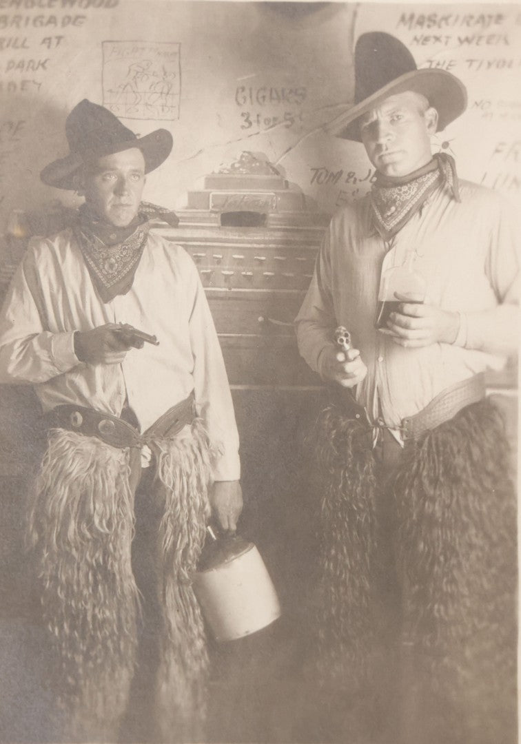 Lot 098 - Single Antique Real Photo Postcard R.P.P.C. Of Two Men Dressed As Cowboys Posing With Pistols And Whiskey