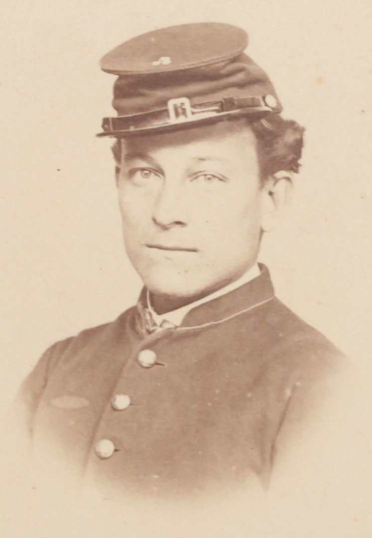 Lot 109 - Grouping Of Six Carte De Visite C.D.V. Portrait Photographs Of Men And Women, Including Man In Suit With Bowtie, Woman In Full Length Dress With Large Skirt, And Man In Officers Uniform With Slouchy Cap