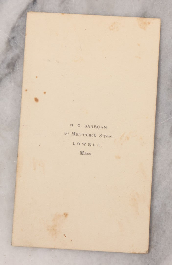 Lot 109 - Grouping Of Six Carte De Visite C.D.V. Portrait Photographs Of Men And Women, Including Man In Suit With Bowtie, Woman In Full Length Dress With Large Skirt, And Man In Officers Uniform With Slouchy Cap