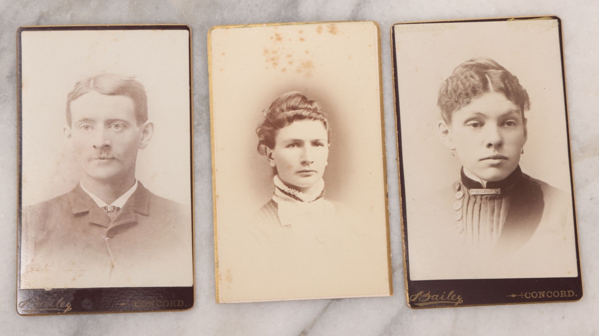 Lot 109 - Grouping Of Six Carte De Visite C.D.V. Portrait Photographs Of Men And Women, Including Man In Suit With Bowtie, Woman In Full Length Dress With Large Skirt, And Man In Officers Uniform With Slouchy Cap