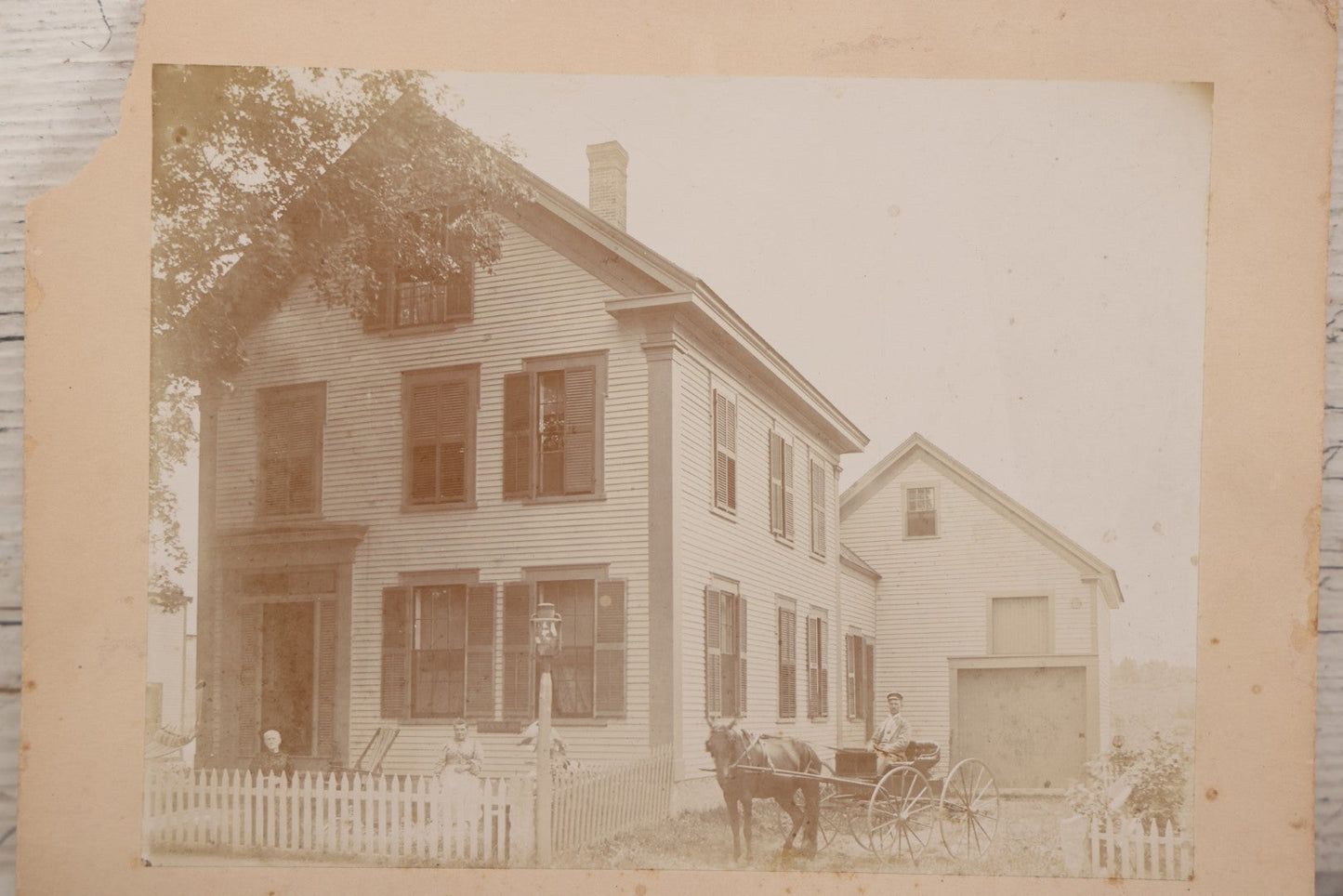 Lot 110 - Boarded Photo Of House Of Dr. E.W. Hoosoon With White Picket Fence, Family Outside, Man On Horse-Drawn Wagon, Photographed By E.W. Smith, Centre Harbor, N.H.