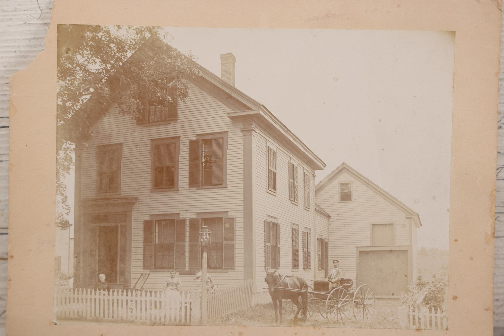 Lot 110 - Boarded Photo Of House Of Dr. E.W. Hoosoon With White Picket Fence, Family Outside, Man On Horse-Drawn Wagon, Photographed By E.W. Smith, Centre Harbor, N.H.