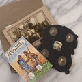 Lot 115 - Antique Ephemera Grouping, Including Paper Frame With 5 Mini Photos Of Young Child From Different Angles And With Parasol, Civil War Centennial Illustrated Postcard, And Real Photo Postcard R.P.P.C. Of Men In Suits Posing On Cow In Paper Folder