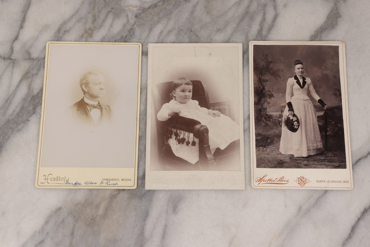 Lot 158 - Grouping Of Fifteen Antique Cabinet Card Photographs Of Men, Women, And Children, Including Woman Holding Hat With Umbrella, Parents With Child, Girl With Locket, And More