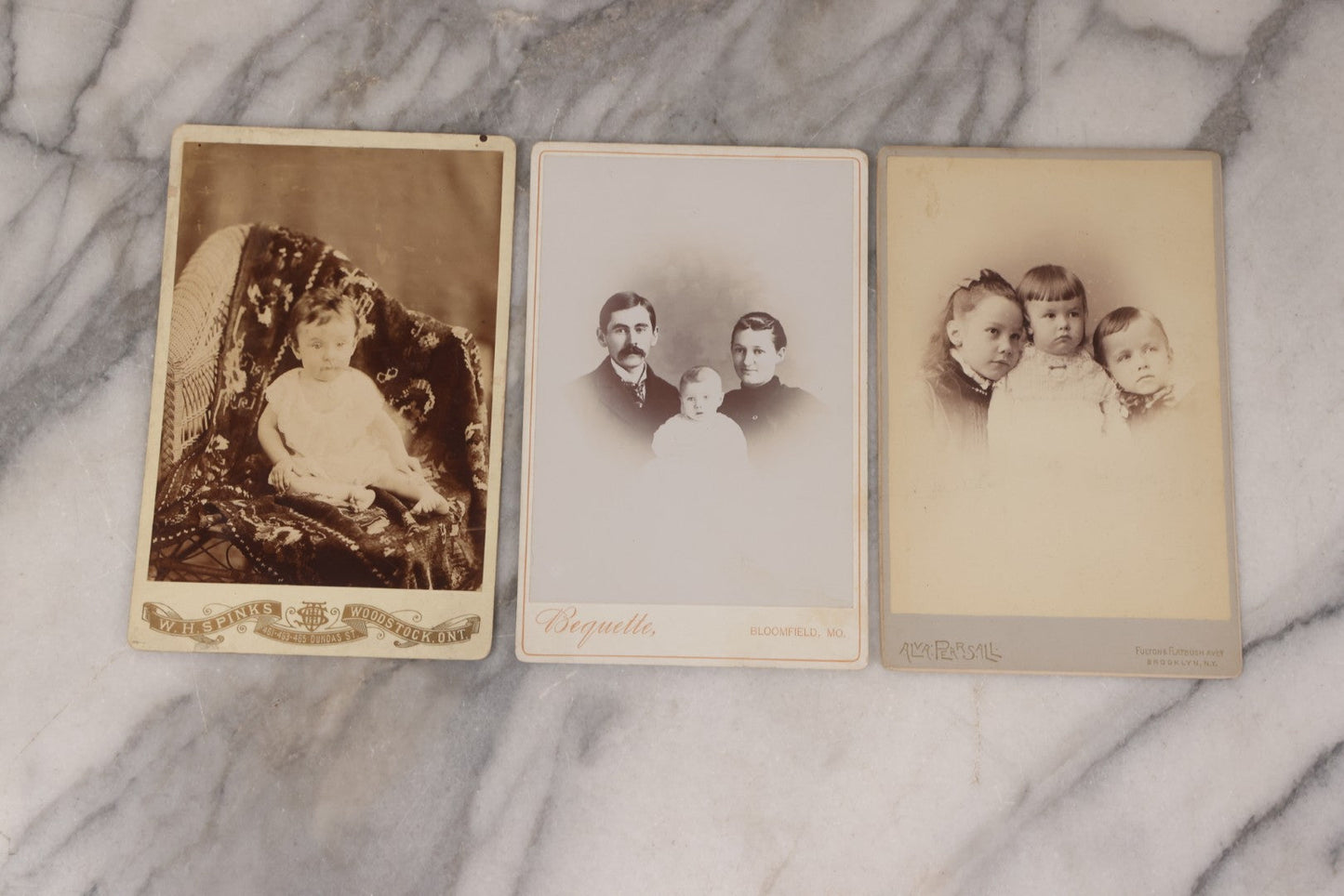 Lot 158 - Grouping Of Fifteen Antique Cabinet Card Photographs Of Men, Women, And Children, Including Woman Holding Hat With Umbrella, Parents With Child, Girl With Locket, And More