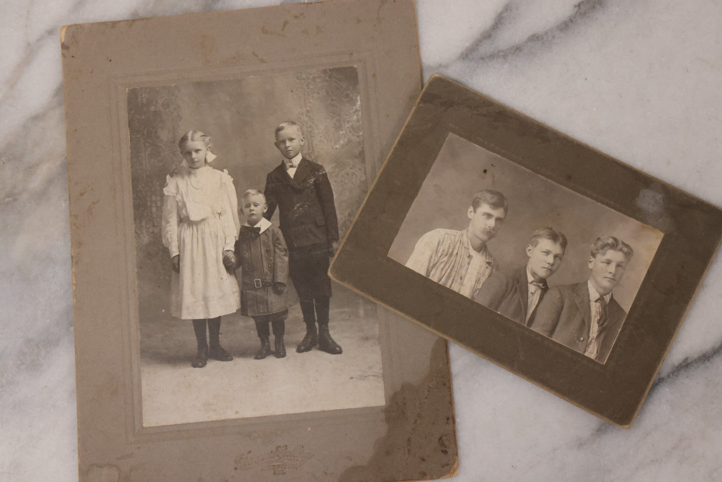 Lot 161 - Grouping Of 11 Antique Boarded, Cabinet Card, And Other Photographs, Including Portrait Of Three Young Men, Baby On Rocking Chair, Wedding Portraits, And More