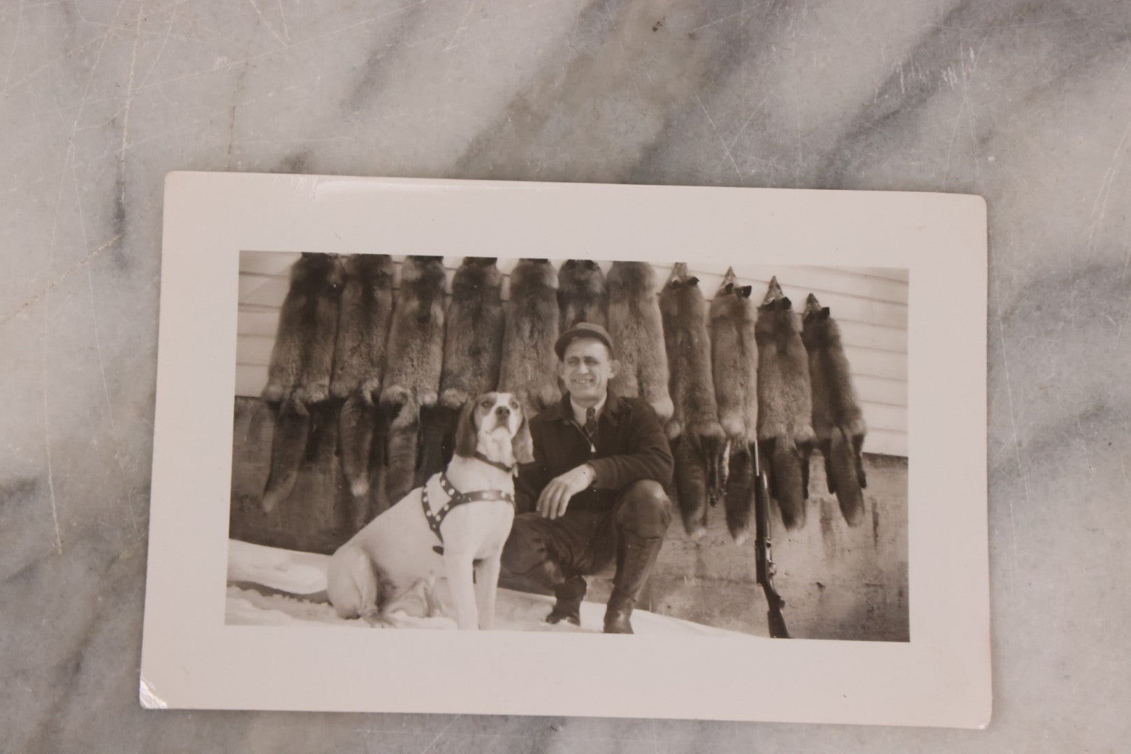 Lot 165 - Grouping Of Nine Vintage Snapshot Photographs Of Outdoorsmen, Hunters, Trappers, Fisherman, And Their Catches, Including Many Photos Of Furs, Hunting Dogs, Etc.