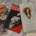 Lot 171 - Vintage And Antique Ephemera Grouping Including Ironbeer Advertisement, Horseshoe Throwing Science Book, Sample Ad Calendar From 1927, Red Cross Booklet, "Work And Win" Weekly Youth Comic, And More