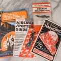 Lot 172 - Vintage Ephemera Grouping Including "New Standard Harmonica Course" Booklet, Pair Of Aircraft Guides, And Model Craftsman Booklet