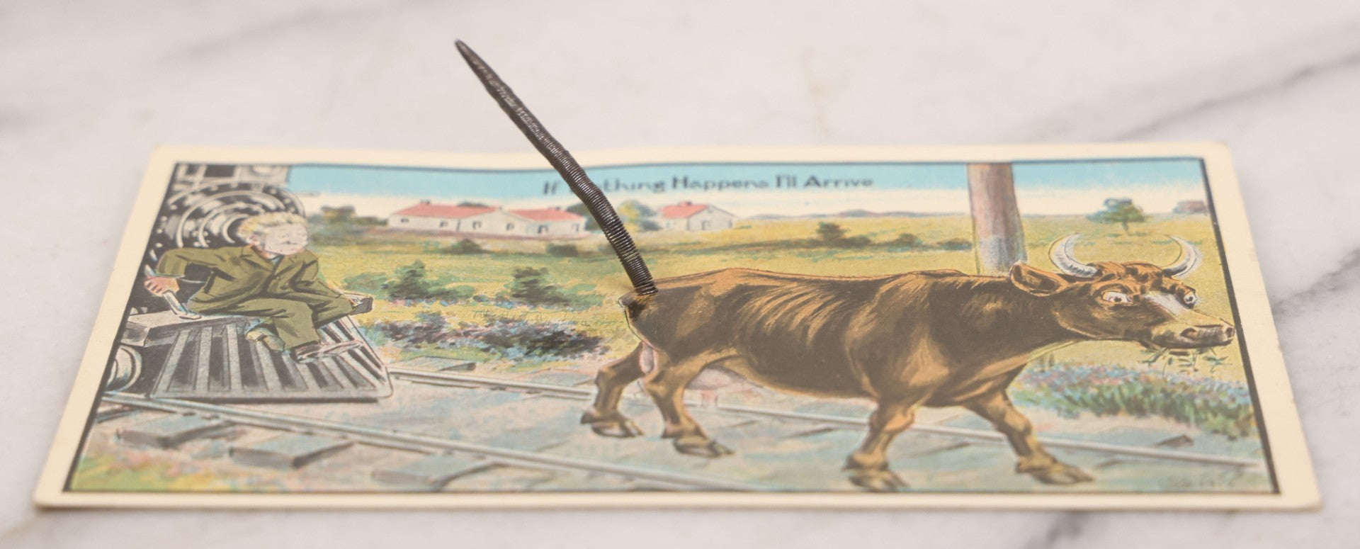 Lot 100 - Antique Comic Novelty Mechanical Postcard , "If Nothing Happens I'll Arrive," With Cow And Real Spring Tail, Speeding Train, Published By Schmidt Bros. & Co., Chicago, Circa 1912