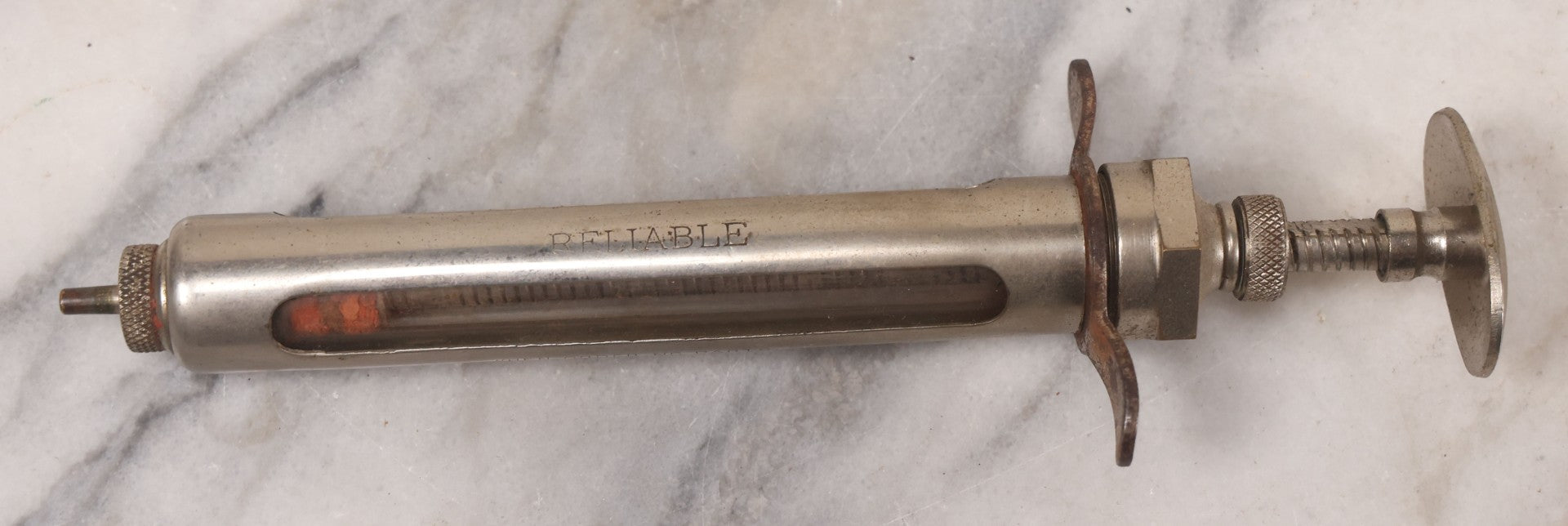 Lot 045 - Antique “Reliable” Brand Syringe No. 3 With Metal Body And Glass Center Tube, With Box Of Vintage B.D. Needles