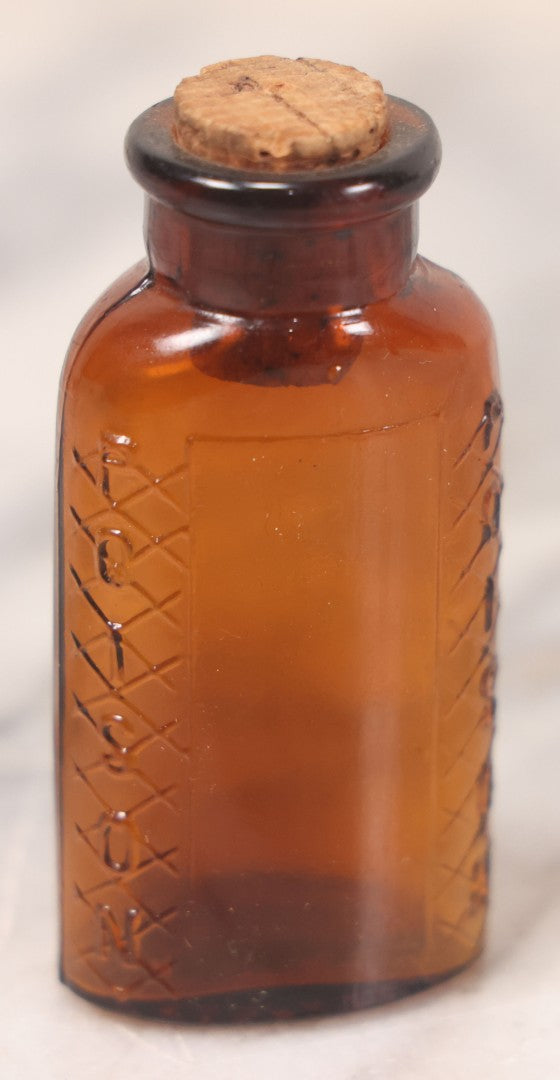 Lot 069 - Grouping Of Six Antique Poison Bottles Including Amber With Crosshatch Poison Ribs, Eli Lilly & Co. Diamond Antiseptics, Clear Chinum Arsenate With Eimer & Amend Lid, East Rock Pharmacy New Haven, And Liggett's Springfield, Ma