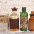 Lot 071 - Grouping Of Six Antique And Vintage Bottles Including Camphorated Oil From Small's Pharmacy, Stonington, Maine, Oil Of Bergamot From Bixby & Co., Montpelier, Vermont, Wright Blood Stain From Hartman Leddon Co., Philadelphia, And Others