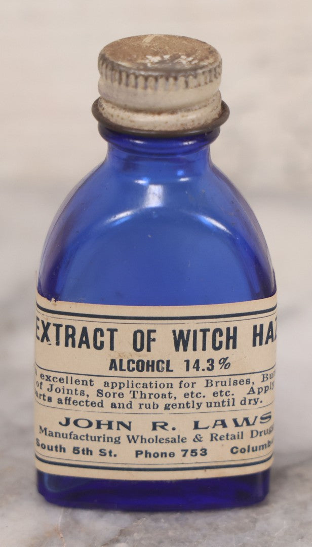 Lot 073 - Grouping Of Five Antique Bottles With Paper Labels Including Witch Hazel, John Laws, Columbus M.S., Spirit Of Peppermint, Koch's Pharm., Greenwich, R.I., Potassium Metabisulphate, Kodak, Mercury, Guterman Dental, N.Y., & Nux Vomica