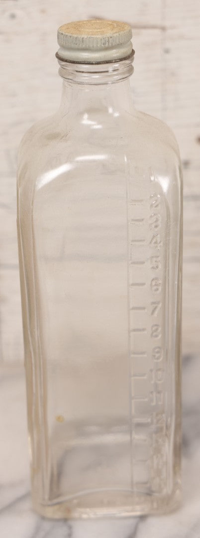 Lot 077 - Pair Of Vintage Clear Glass Embalming Fluid Bottles With Paper Labels And Caps Including Regal Arterial From Regal Fluid Co., Washington, D.C., And Hydrol Phenox From Hydrol Chemical Co., Philadelphia