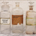 Lot 081 - Grouping Of Three Antique Clear Glass Apothecary Bottles Including Codeinae Sulfas F&S St. Louis, Bottle With Illegible Paper Label, And Otto Jafnel Pharmacist Liberty Ny