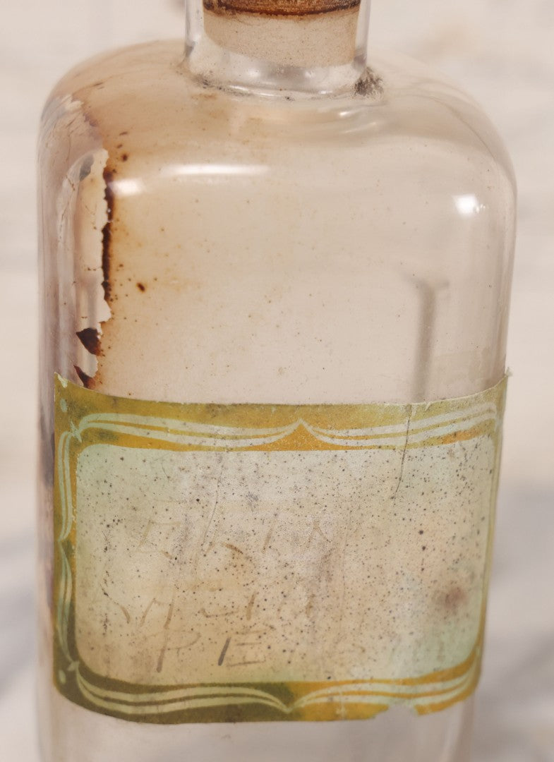 Lot 081 - Grouping Of Three Antique Clear Glass Apothecary Bottles Including Codeinae Sulfas F&S St. Louis, Bottle With Illegible Paper Label, And Otto Jafnel Pharmacist Liberty Ny