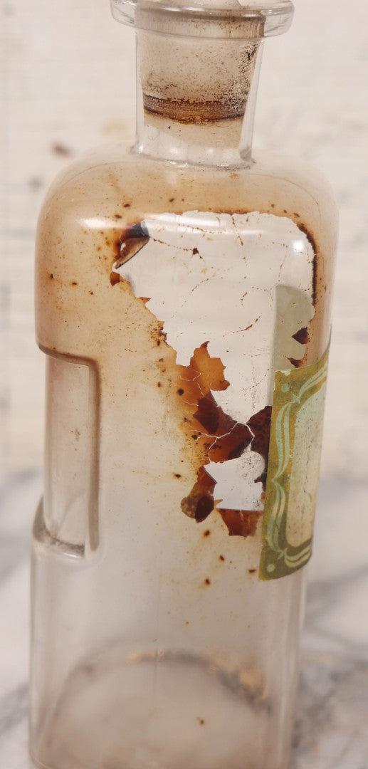 Lot 081 - Grouping Of Three Antique Clear Glass Apothecary Bottles Including Codeinae Sulfas F&S St. Louis, Bottle With Illegible Paper Label, And Otto Jafnel Pharmacist Liberty Ny