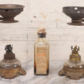 Lot 082 - Antique Vapo-Cresolene Lot Including Two Brass Vaporizers With Lamps (One Complete, One Incomplete) And Poison Bottle With Studded Poison Ribs And Paper Label, Vapo-Cresolene Co., New York, NY