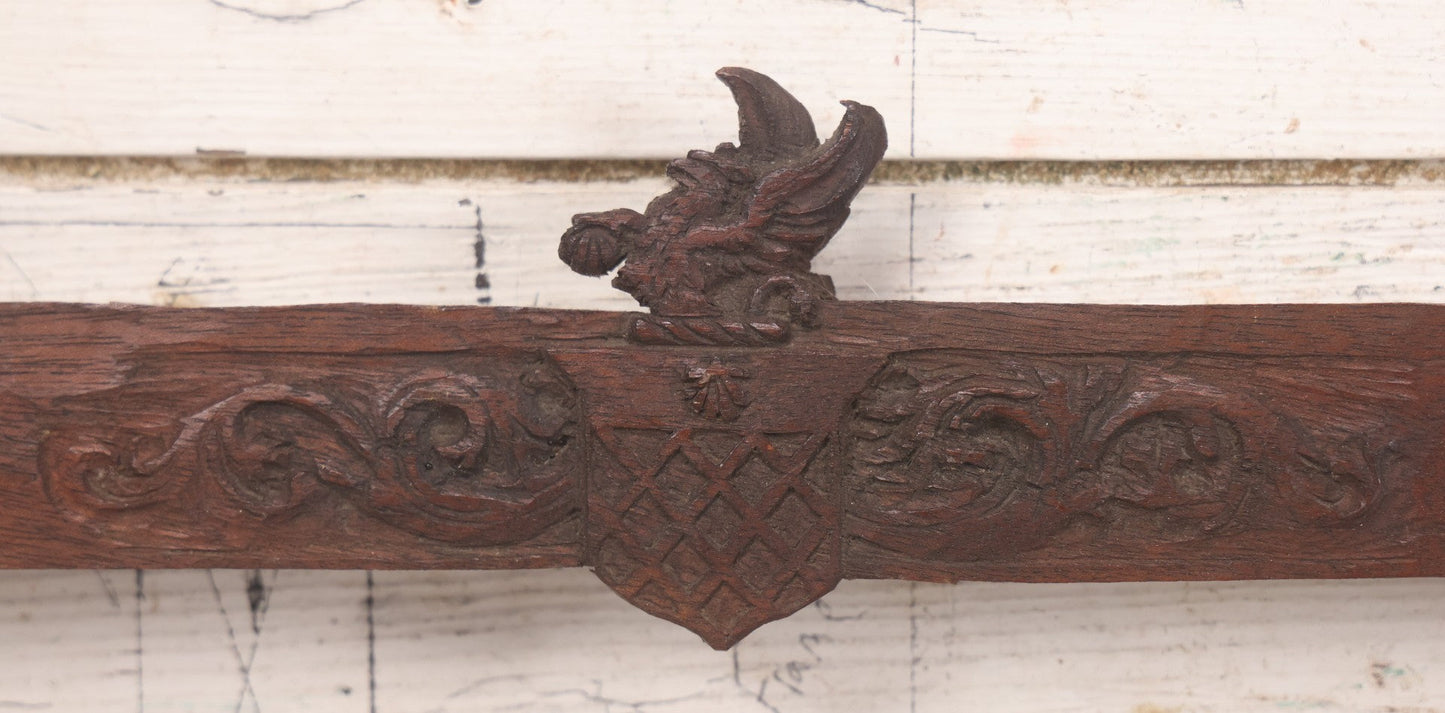Lot 086 - Antique Hand Carved Wood Folk Art Frame With Griffin Motif, Coat Of Arms, Cherub Corners, Original Finish, 18-1/2" x 9-1/4"