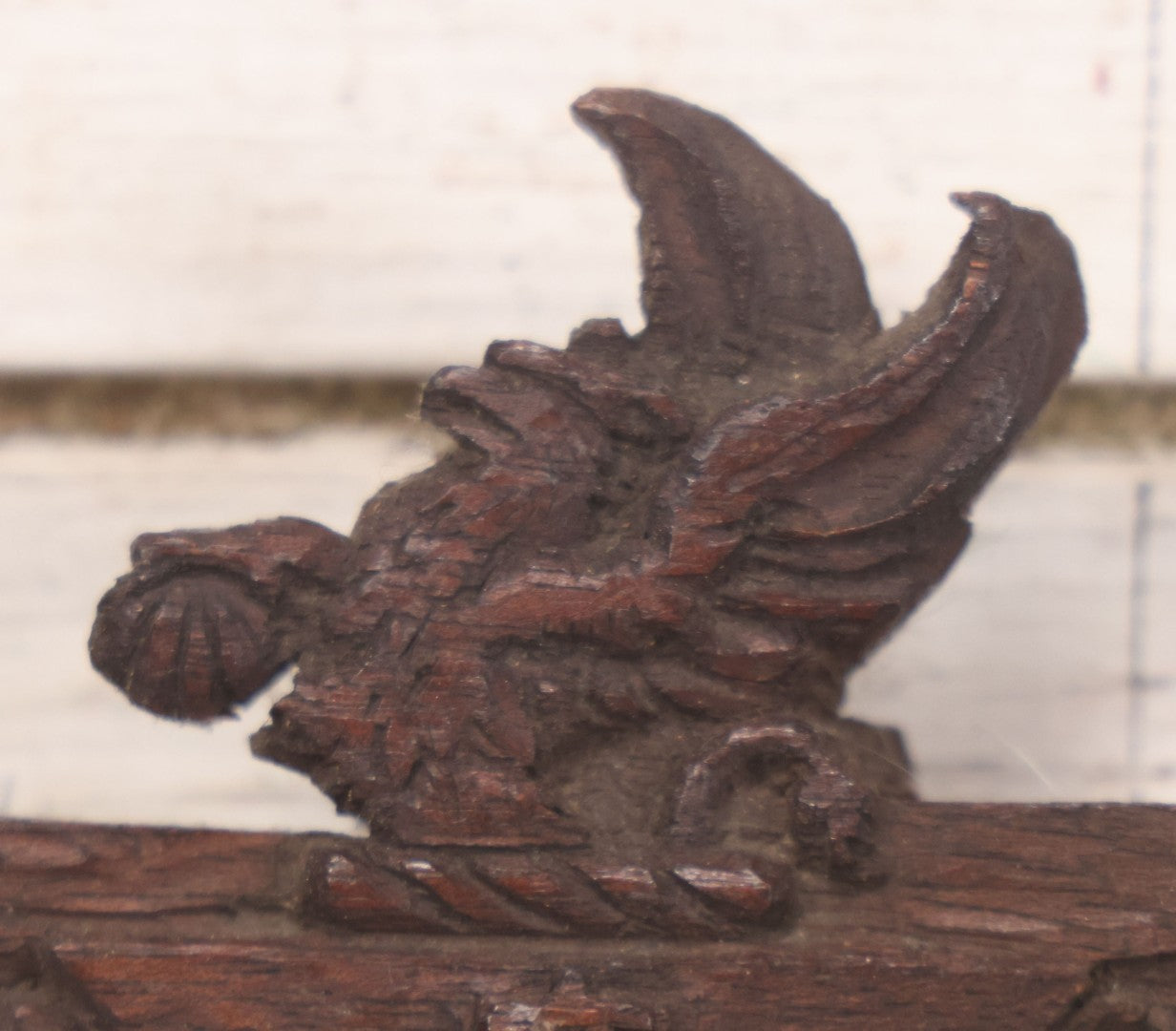 Lot 086 - Antique Hand Carved Wood Folk Art Frame With Griffin Motif, Coat Of Arms, Cherub Corners, Original Finish, 18-1/2" x 9-1/4"