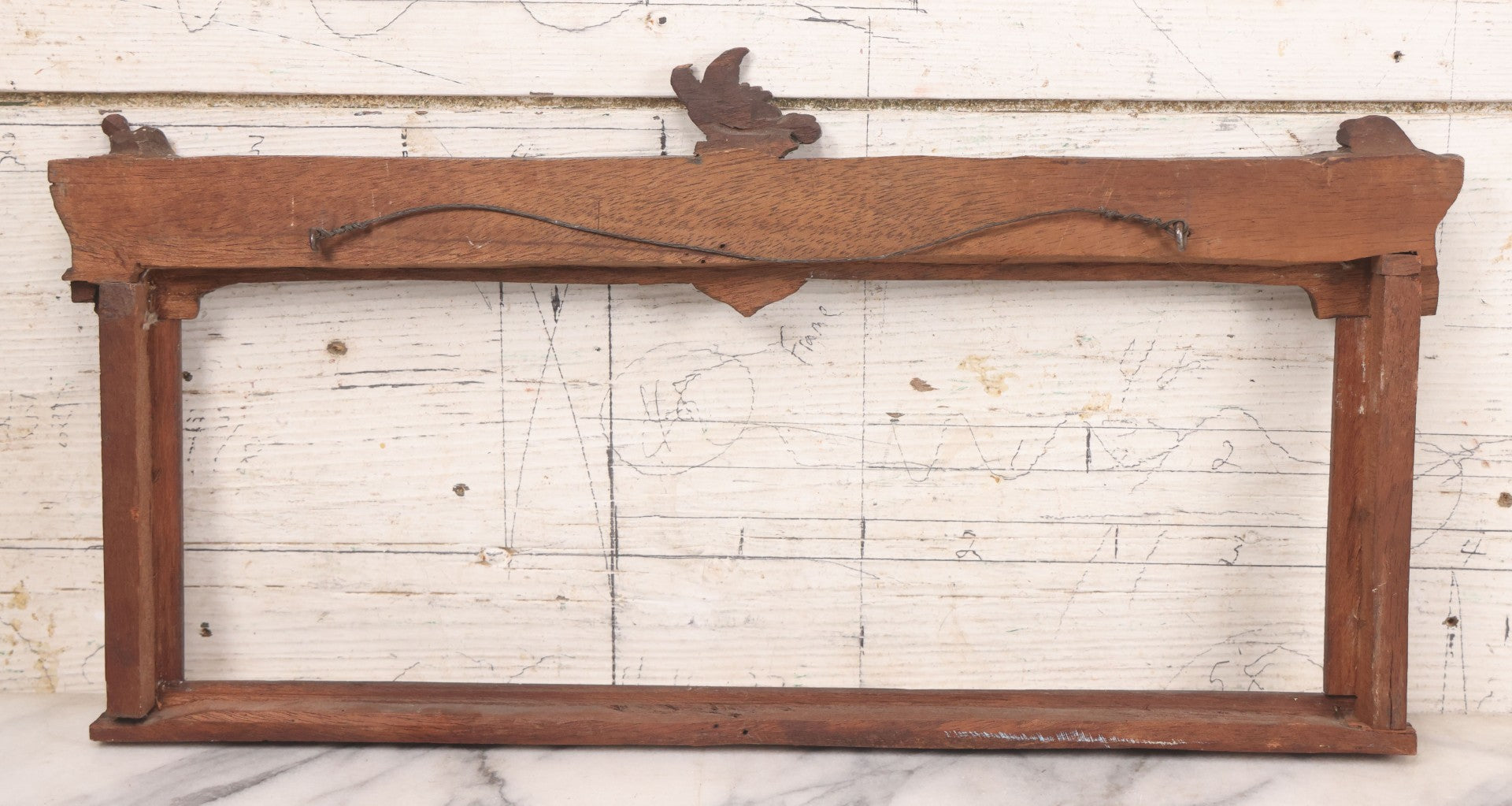 Lot 086 - Antique Hand Carved Wood Folk Art Frame With Griffin Motif, Coat Of Arms, Cherub Corners, Original Finish, 18-1/2" x 9-1/4"