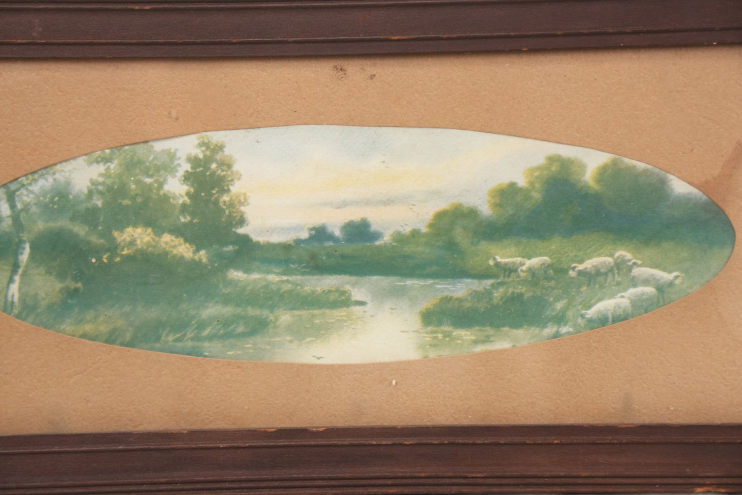 Lot 091 - Antique Landscape Print Of Sheep In A Field By A River With Oval Cut Mat, In Long Narrow Frame, 6-1/2" x 13-1/2"