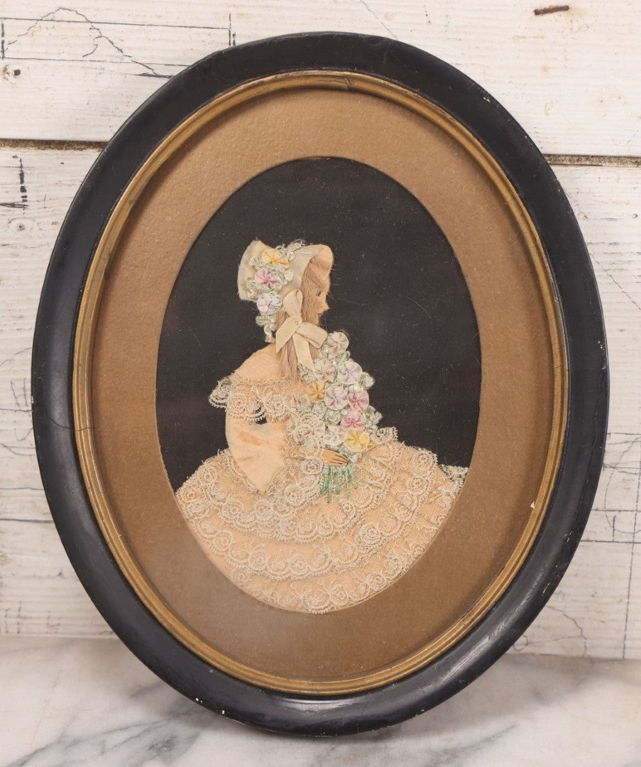 Lot 104 - Grouping Of Three Vintage Framed Ribbon Ladies, Including Woman In White Lace Dress With Real Hair In Oval Frame, Woman In Green And Woman In Pink, 8-3/4" x 10-3/4"