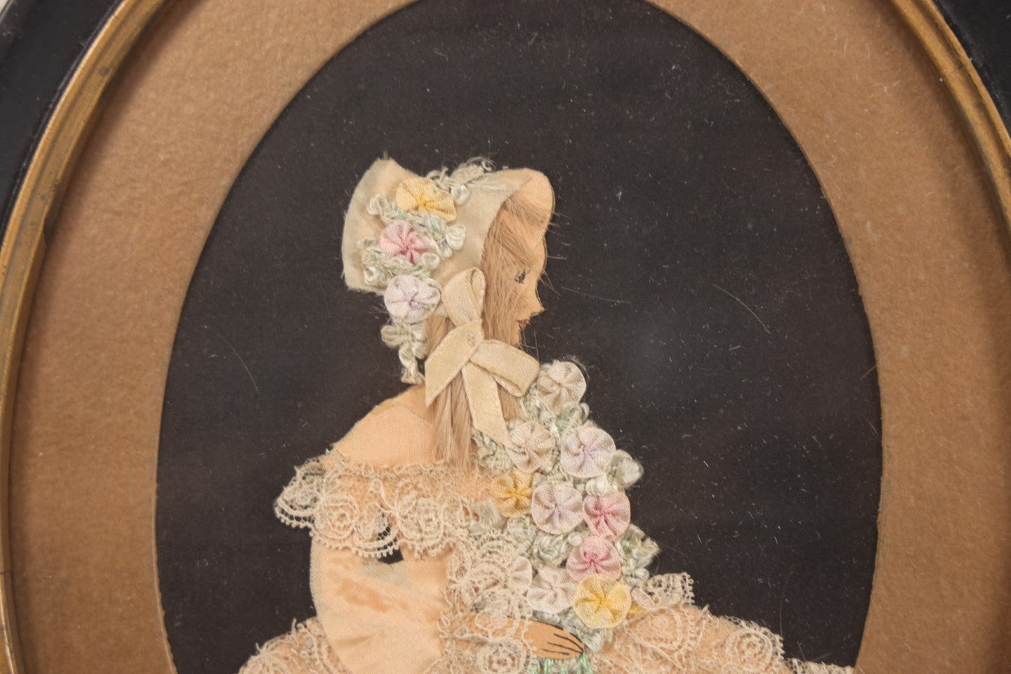 Lot 104 - Grouping Of Three Vintage Framed Ribbon Ladies, Including Woman In White Lace Dress With Real Hair In Oval Frame, Woman In Green And Woman In Pink, 8-3/4" x 10-3/4"