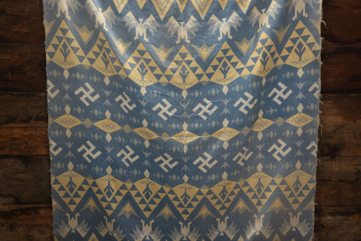 Lot 011 - Vintage Navajo-Style Textile Camp Blanket With Whirling Logs And Thunderbird Motifs, Blue And Yellow, Circa 1920s 60" x 70"