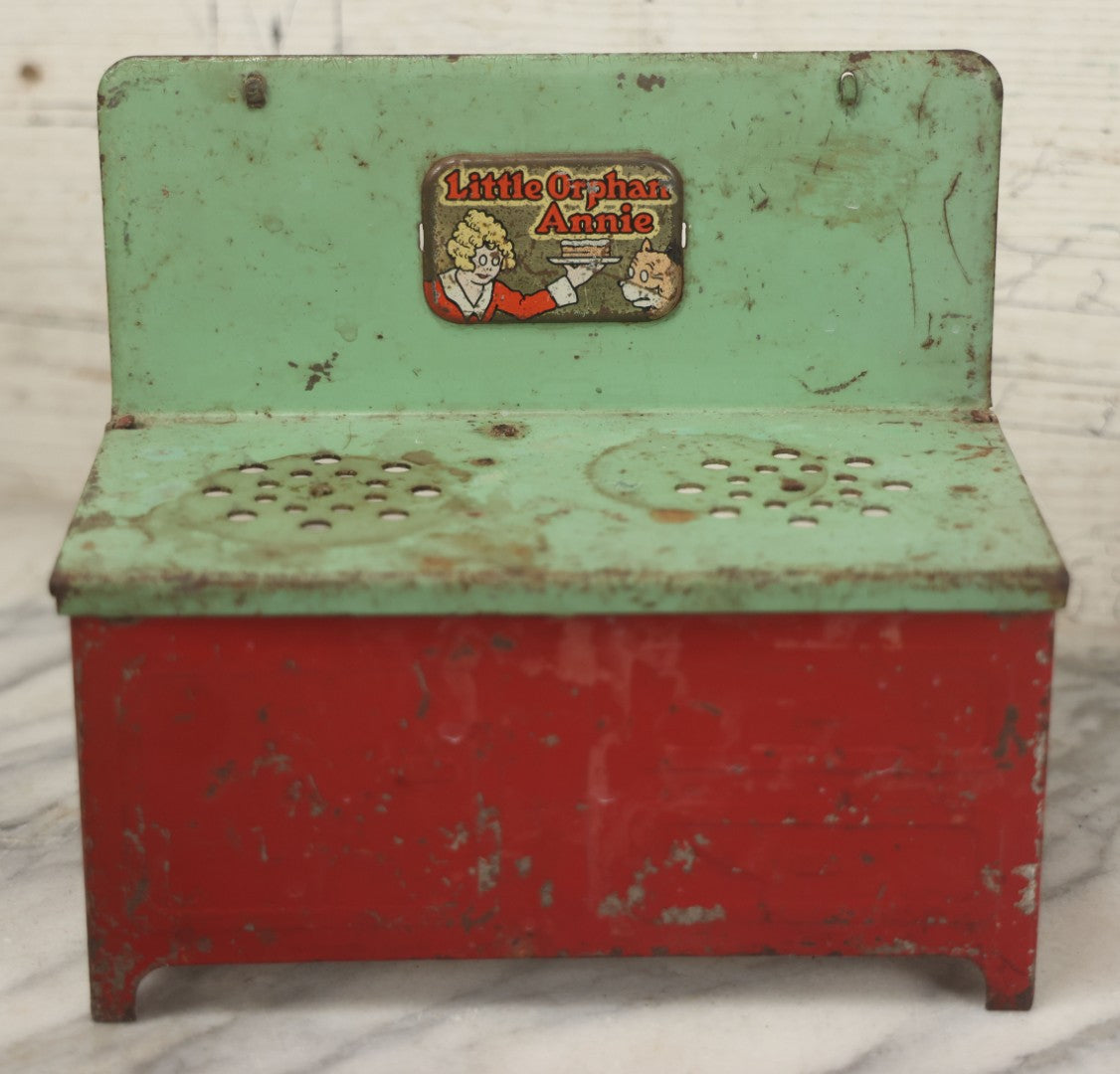 Lot 081 - Vintage Little Orphan Annie Tin Lithograph Toy Stove With Red And Green Paint, Circa 1930s Note Surface Wear And Rust