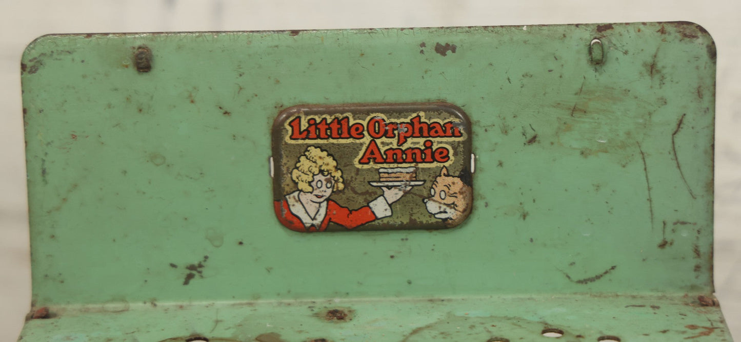 Lot 081 - Vintage Little Orphan Annie Tin Lithograph Toy Stove With Red And Green Paint, Circa 1930s Note Surface Wear And Rust