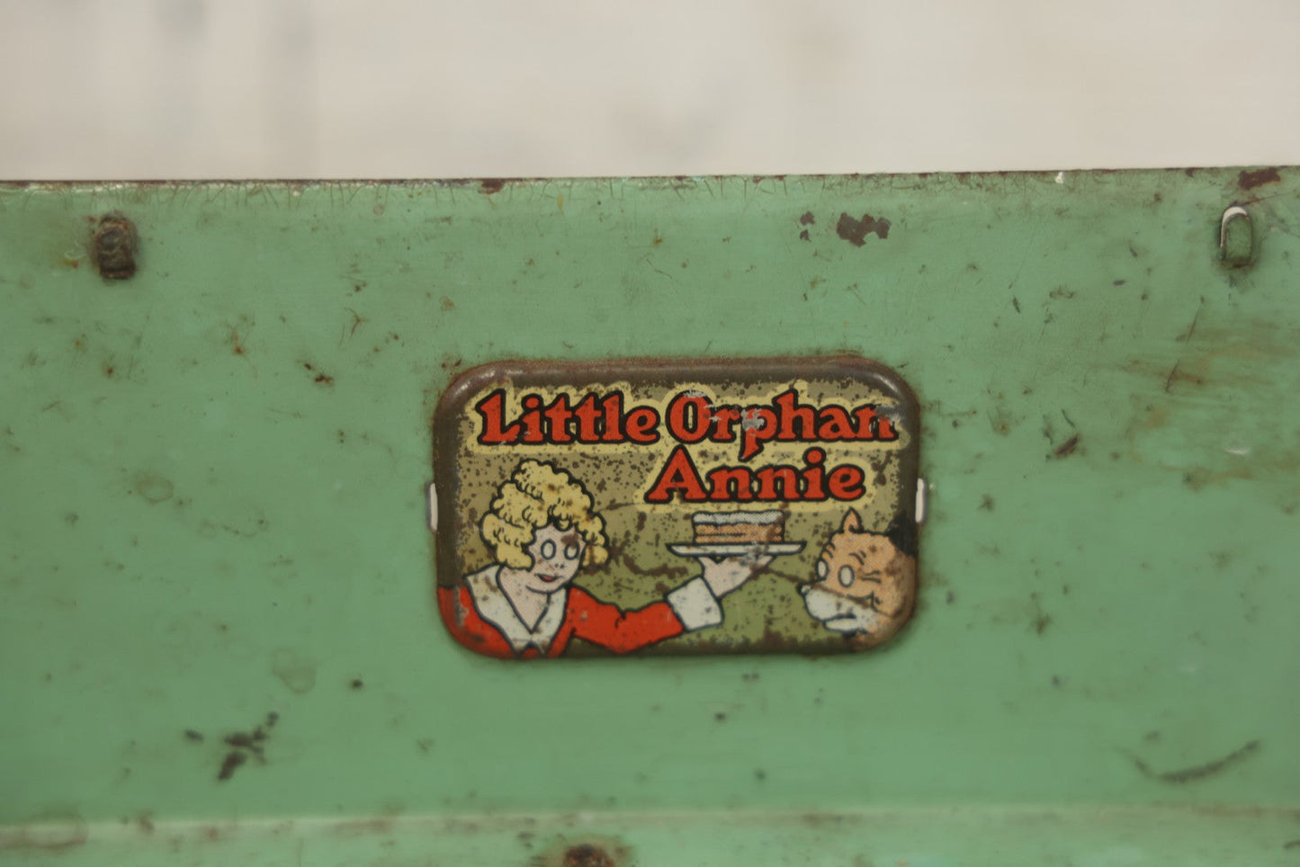 Lot 081 - Vintage Little Orphan Annie Tin Lithograph Toy Stove With Red And Green Paint, Circa 1930s Note Surface Wear And Rust