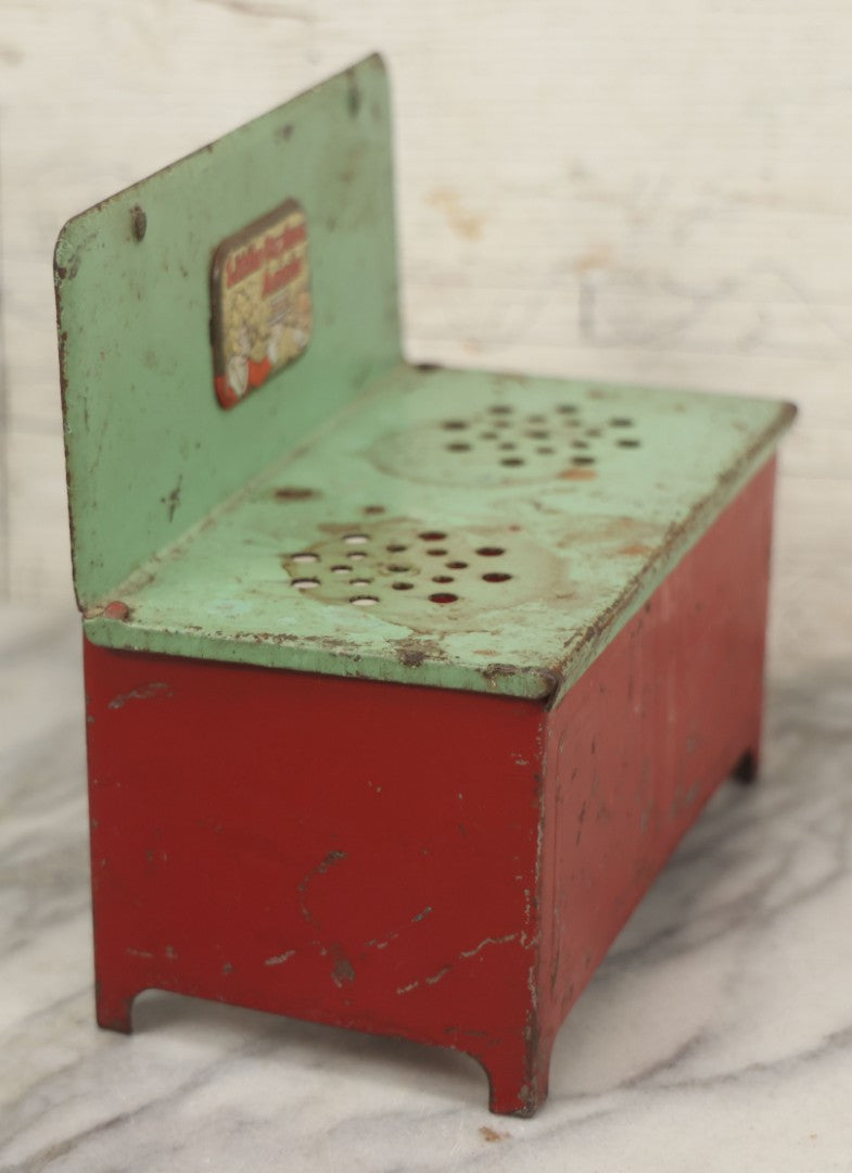 Lot 081 - Vintage Little Orphan Annie Tin Lithograph Toy Stove With Red And Green Paint, Circa 1930s Note Surface Wear And Rust