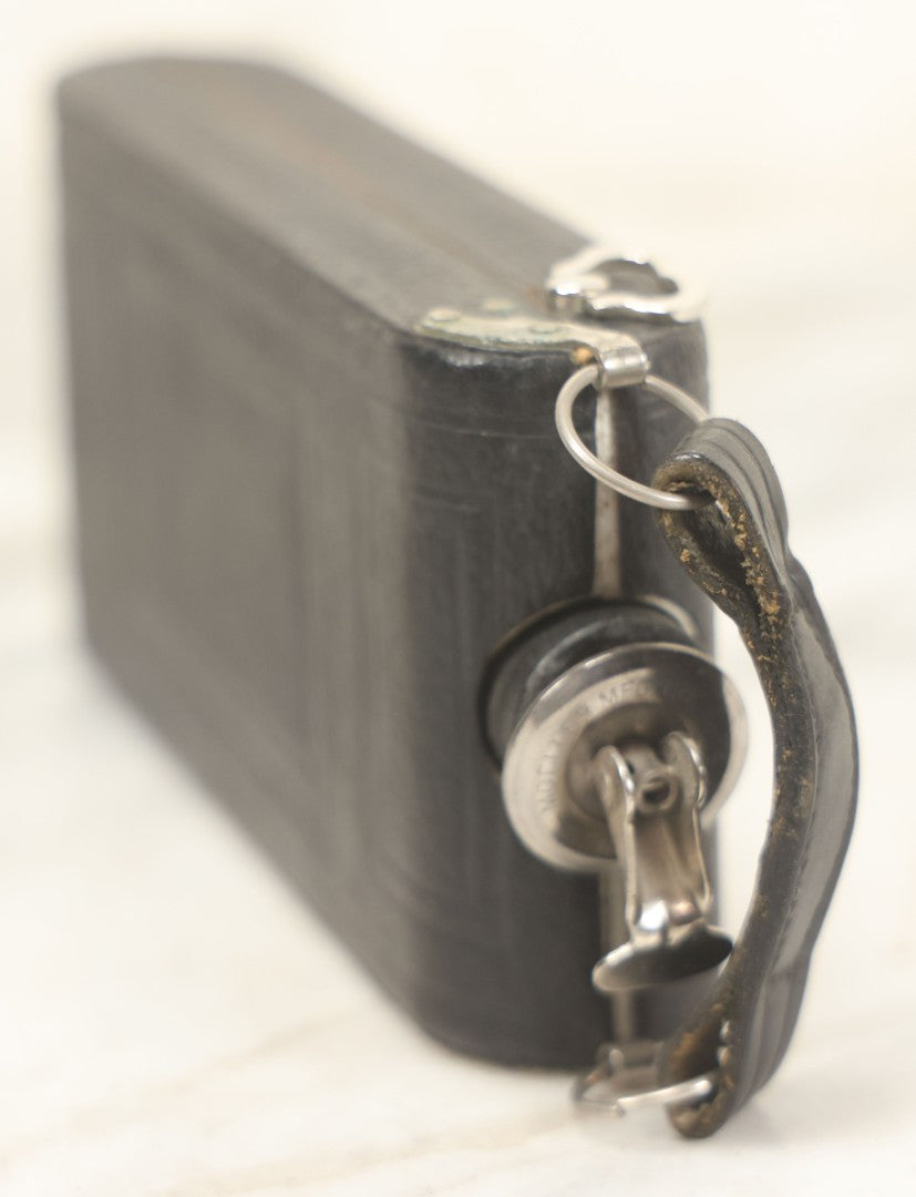 Lot 085 - Vintage Drinking Flask Disguised As Antique Folding Camera With Internal Pyrex Glass Flask, Note Missing Screw And Worn Stopper