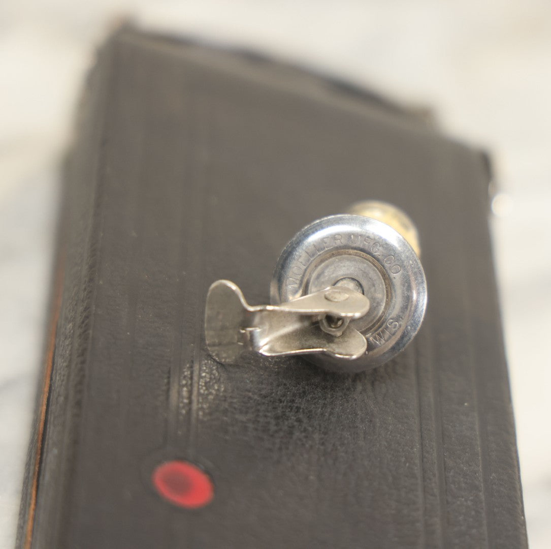 Lot 085 - Vintage Drinking Flask Disguised As Antique Folding Camera With Internal Pyrex Glass Flask, Note Missing Screw And Worn Stopper