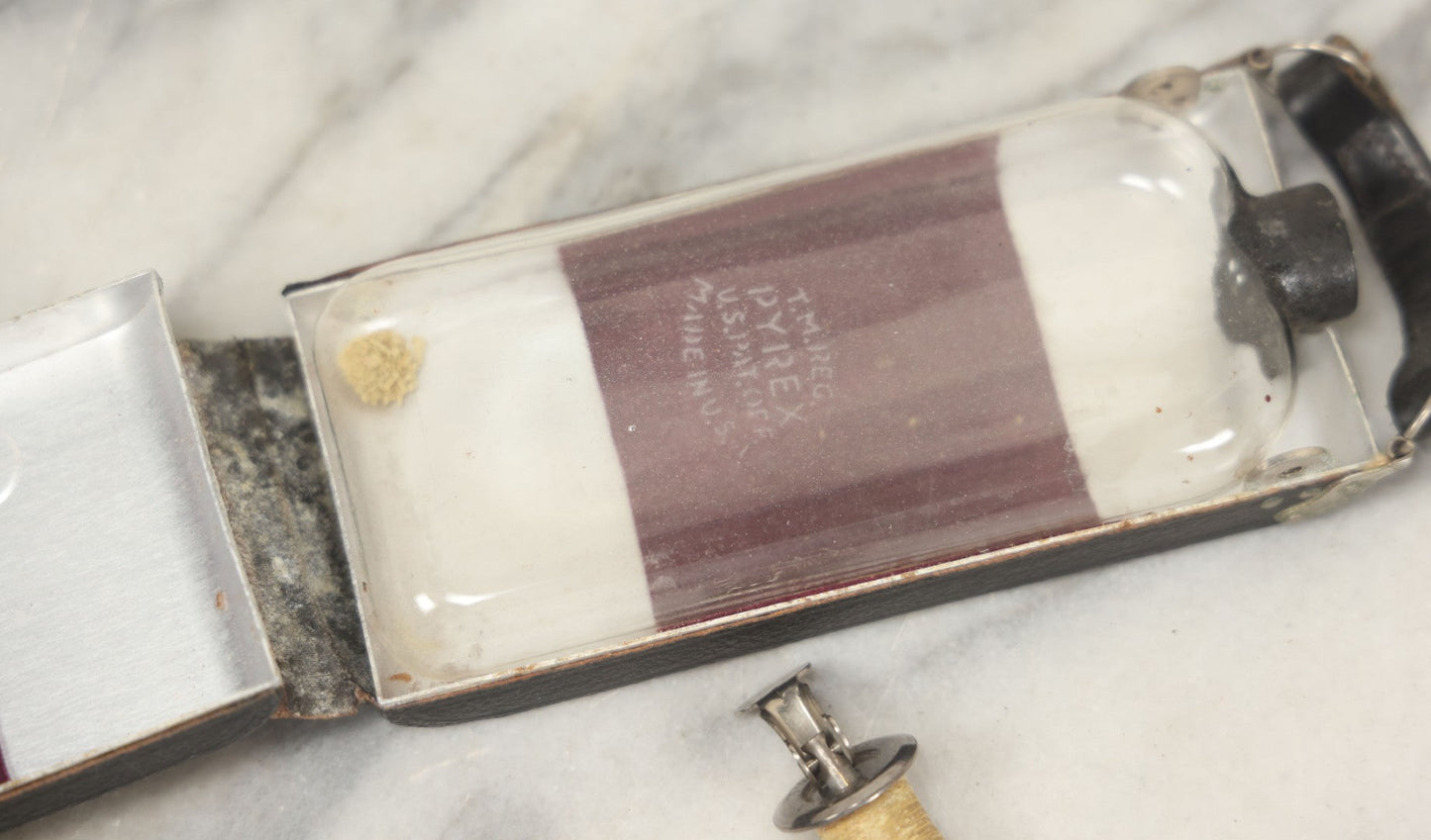 Lot 085 - Vintage Drinking Flask Disguised As Antique Folding Camera With Internal Pyrex Glass Flask, Note Missing Screw And Worn Stopper