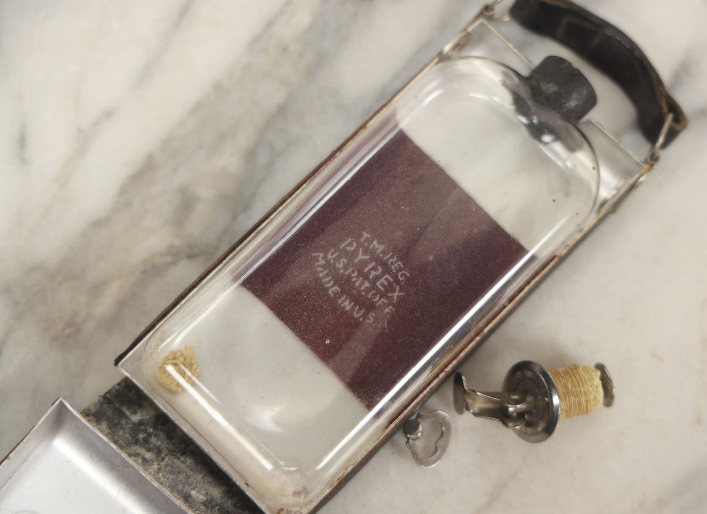 Lot 085 - Vintage Drinking Flask Disguised As Antique Folding Camera With Internal Pyrex Glass Flask, Note Missing Screw And Worn Stopper