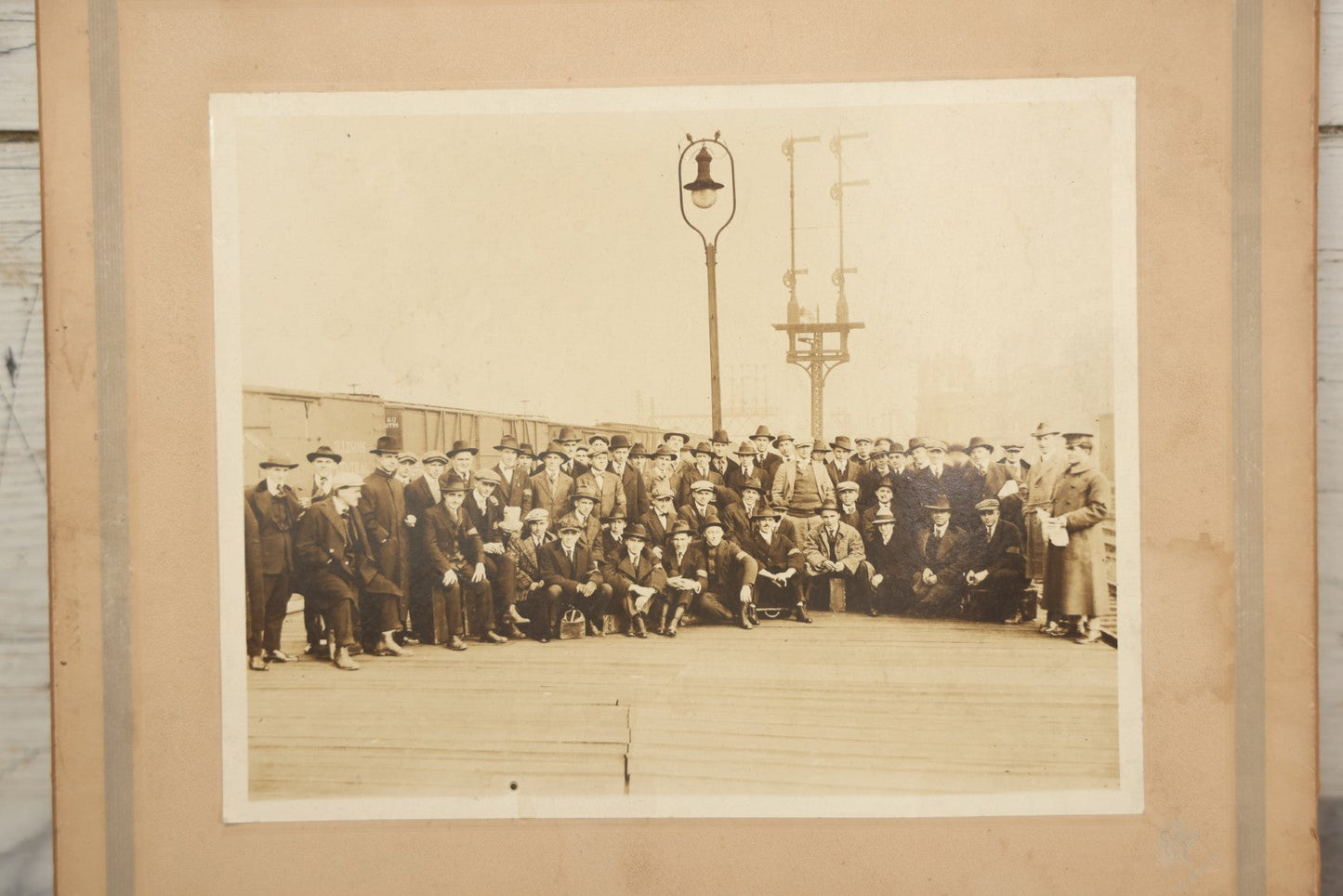 Lot 092 - Antique Boarded Photograph Of Group Of Men In Suits And Hats Posing In Front Of An Illinois Central Railroad Train, Note Warped