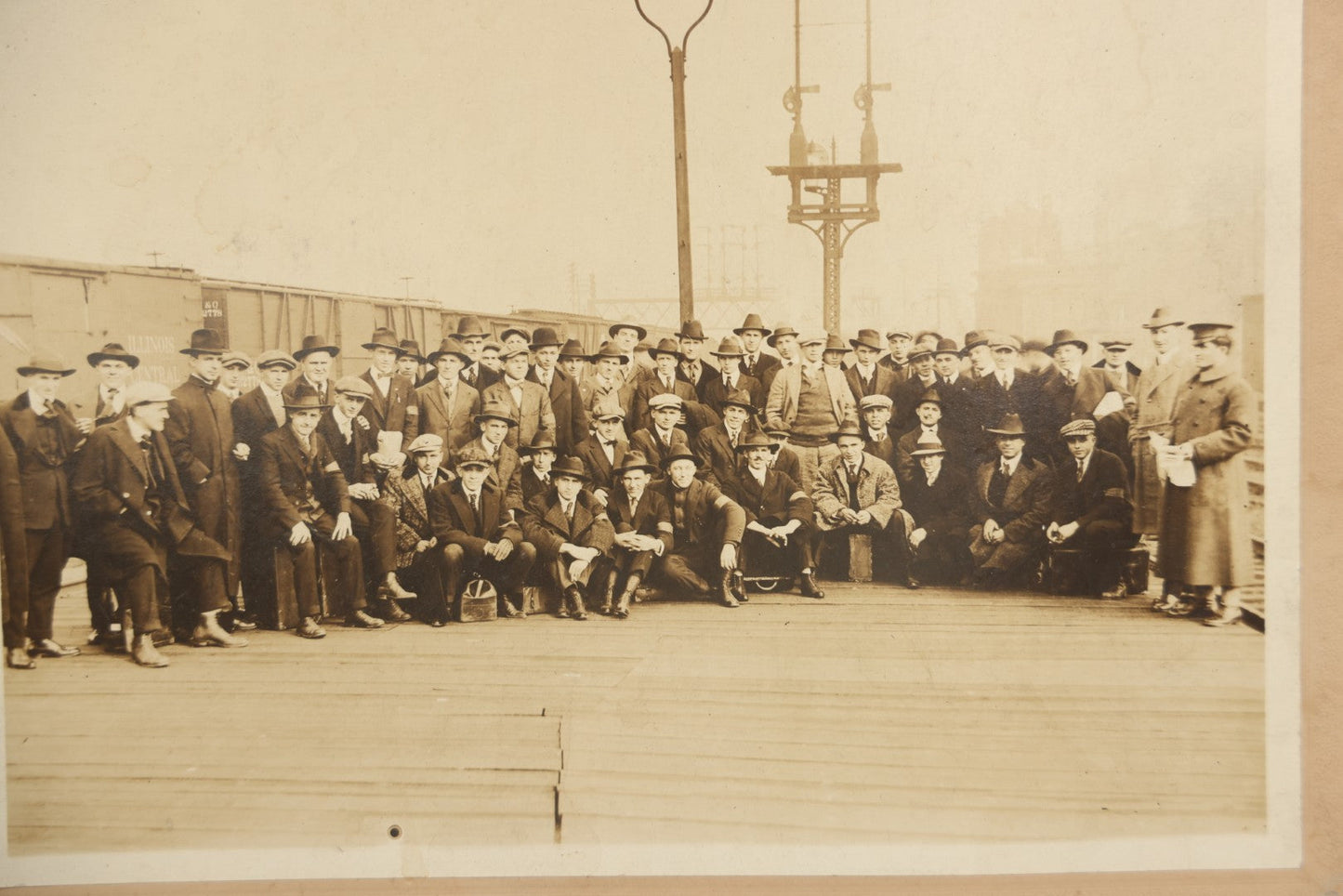 Lot 092 - Antique Boarded Photograph Of Group Of Men In Suits And Hats Posing In Front Of An Illinois Central Railroad Train, Note Warped