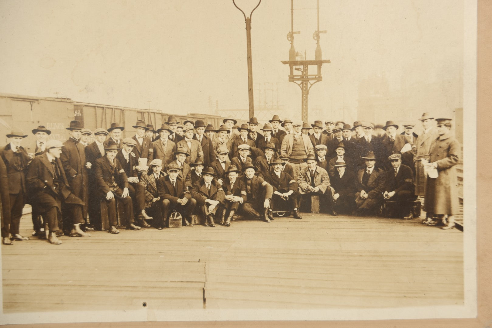 Lot 092 - Antique Boarded Photograph Of Group Of Men In Suits And Hats Posing In Front Of An Illinois Central Railroad Train, Note Warped