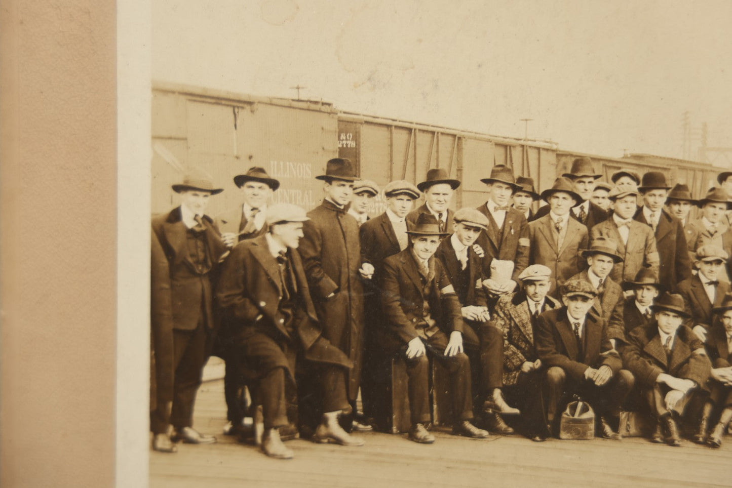 Lot 092 - Antique Boarded Photograph Of Group Of Men In Suits And Hats Posing In Front Of An Illinois Central Railroad Train, Note Warped