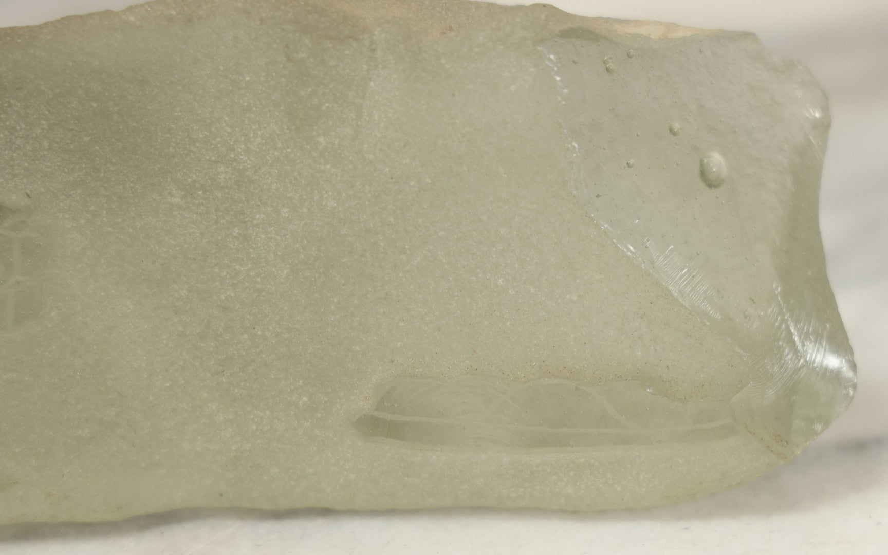 Lot 102 - Vintage Frosted Glass Sculptural Piece With Etched Inuit Figure And Sled Scene