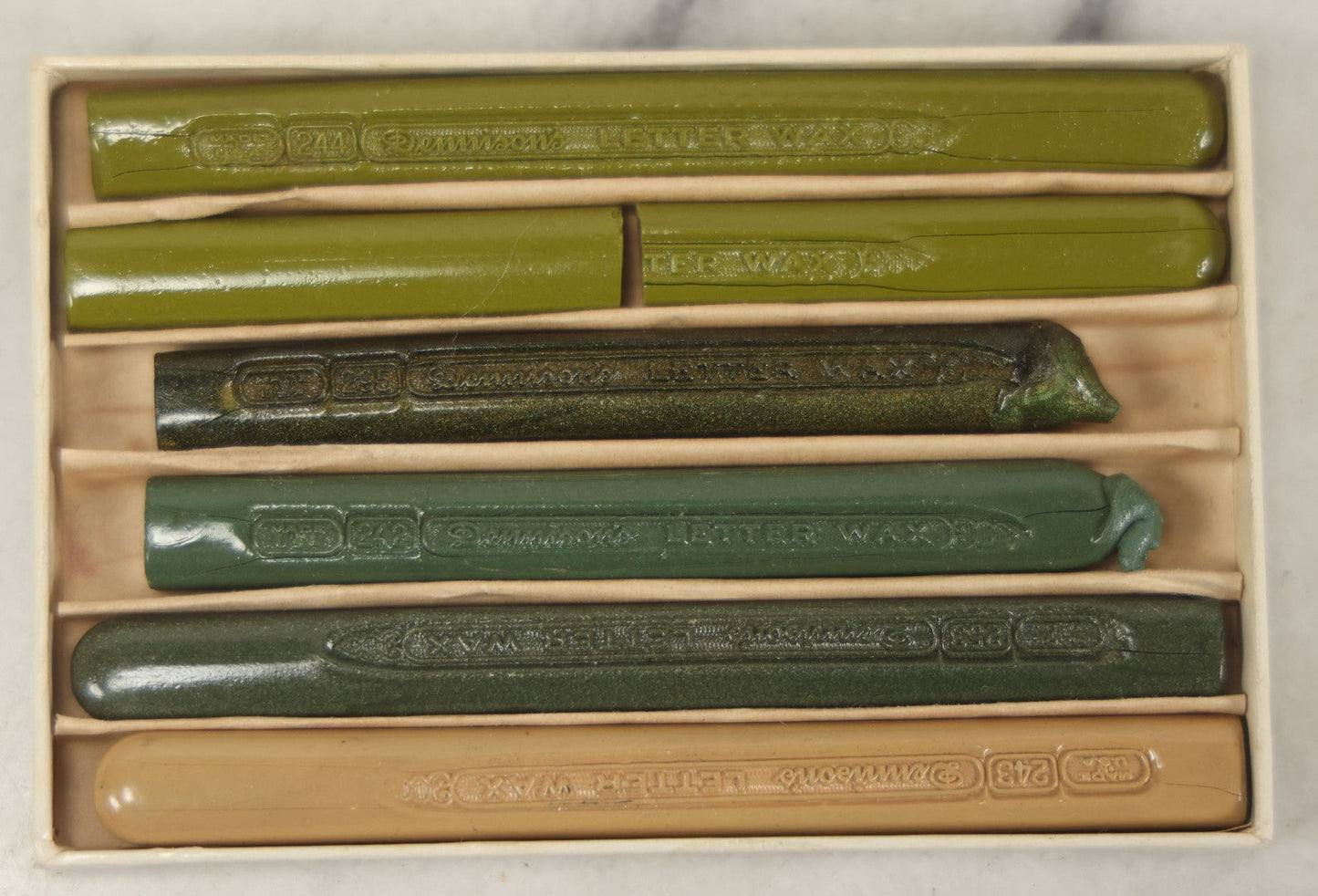 Lot 113 - Box Of Five Dennison's Letter Sealing Wax Sticks In Shades Of Green, Lightly Used, One Broken In Half
