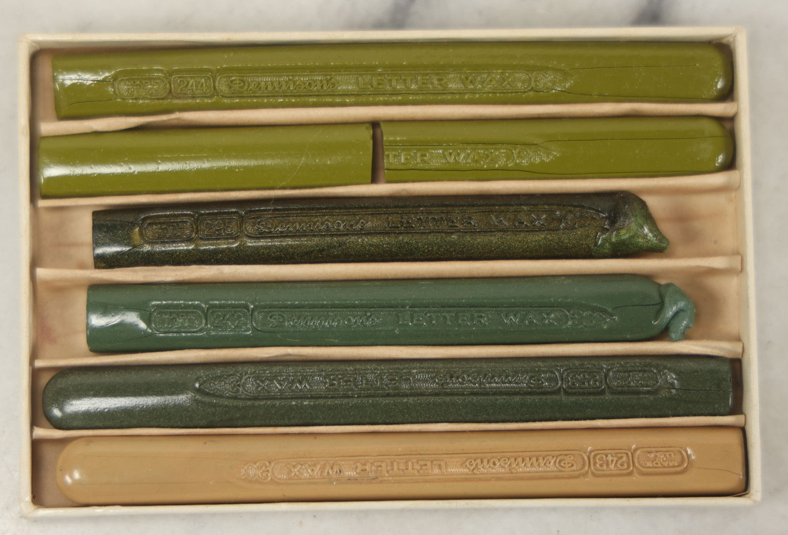 Lot 113 - Box Of Five Dennison's Letter Sealing Wax Sticks In Shades Of Green, Lightly Used, One Broken In Half